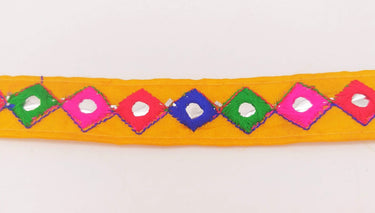 Wholesale Yellow Cotton Fabric Mirrored Trim With Embroidery In Fuchsia Pink, Blue, Red & Green Threads